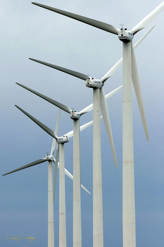 091 Wind Turbines, near Godknowswhere, TX or NM -- Shortly after this I arrived in Tucumcari, NM and suddenly realized my tachometer was freaking out -- flat lining when accelerating, leaping up when foot off the gas.  That was swiftly followed by noticing my power windows wouldn't go up or down and that the battery gauge showed zero!