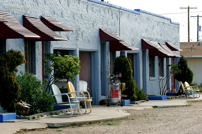 101 Motel Courtyard, Tucumcari, NM -- So to kill time I hop on the Internet and leave a message on a photo forum I frequent that I am broken down in Tucumcari with a probable dead alternator.  45-minutes later I hit the shop to see if they have looked at it yet.  Yep, car is done and it was the alternator ... ouch!  As I am getting ready to pay the mechanic gets this serious look on his face and I think, 